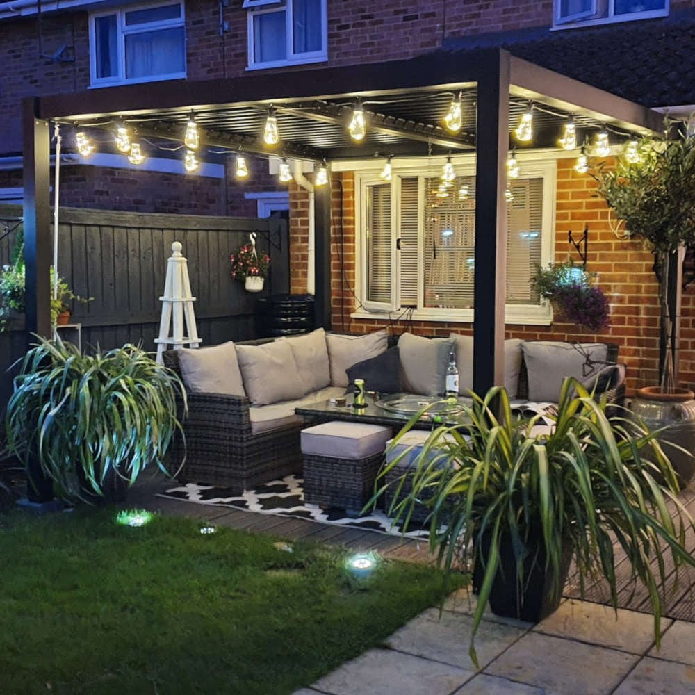 Deluxe Charcoal Pergola with roof. Outdoor patio area with a pergola