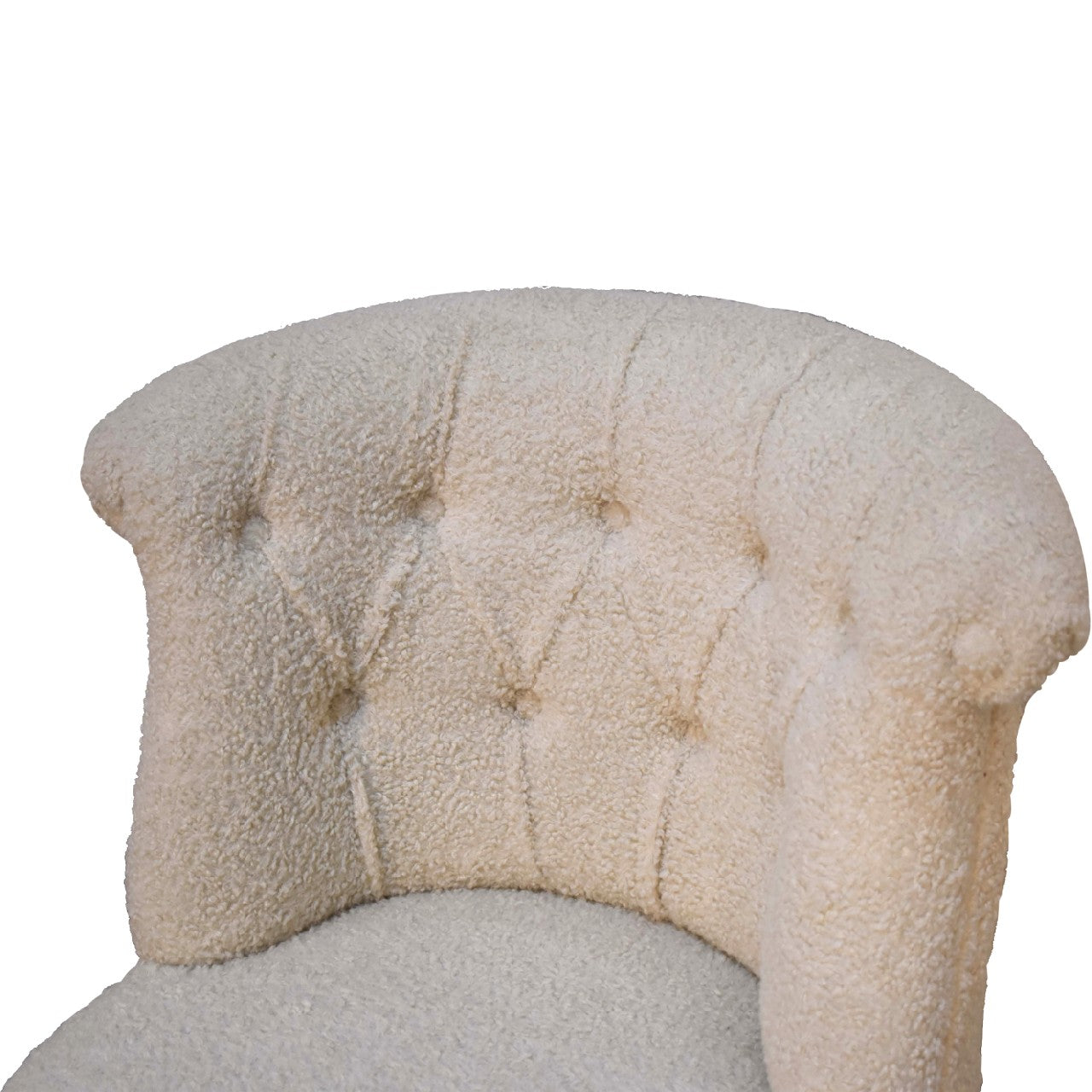 Cream boucle accent chair.
