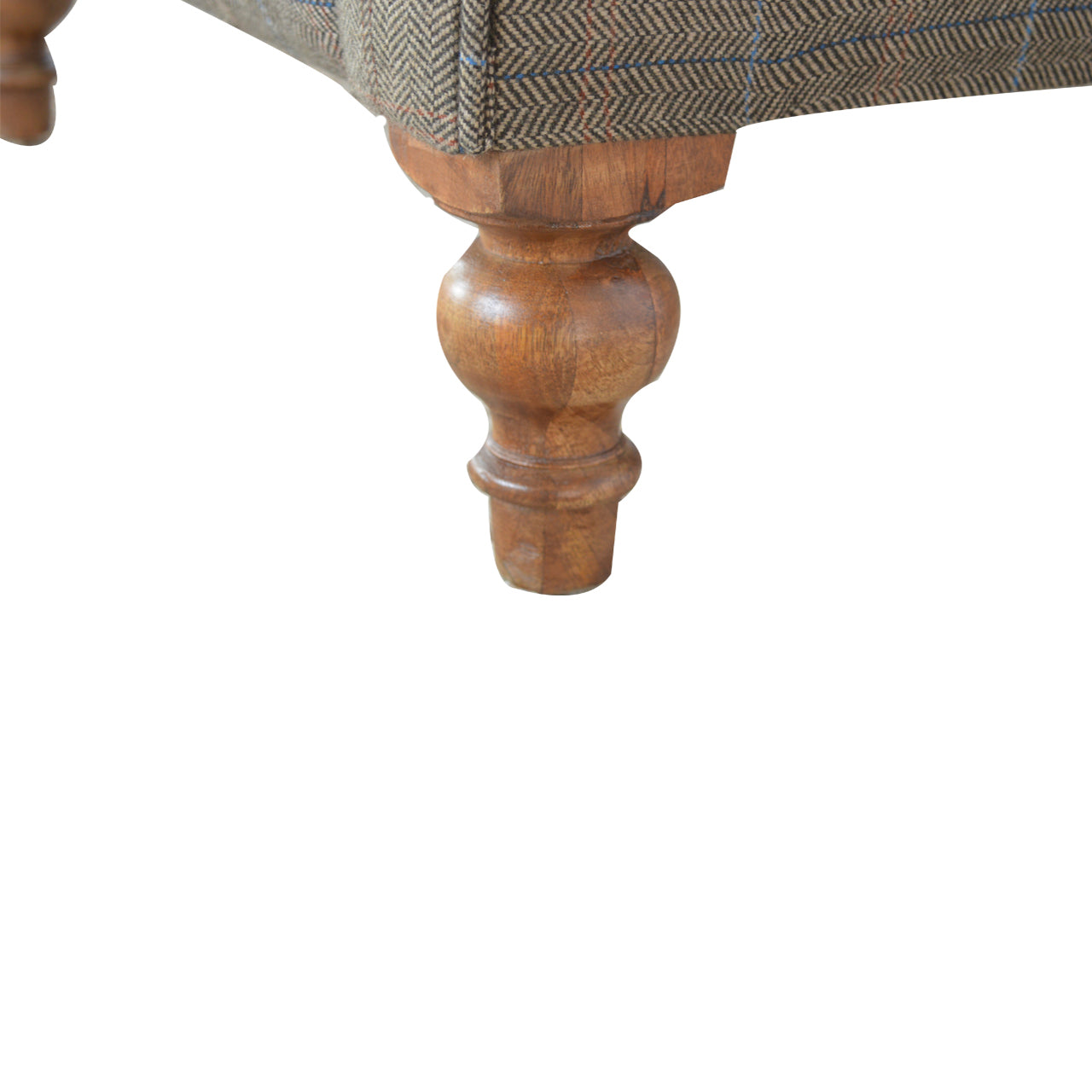 Tweed Chesterfield Chair. Close-up of a wooden chair leg with a textured fabric seat