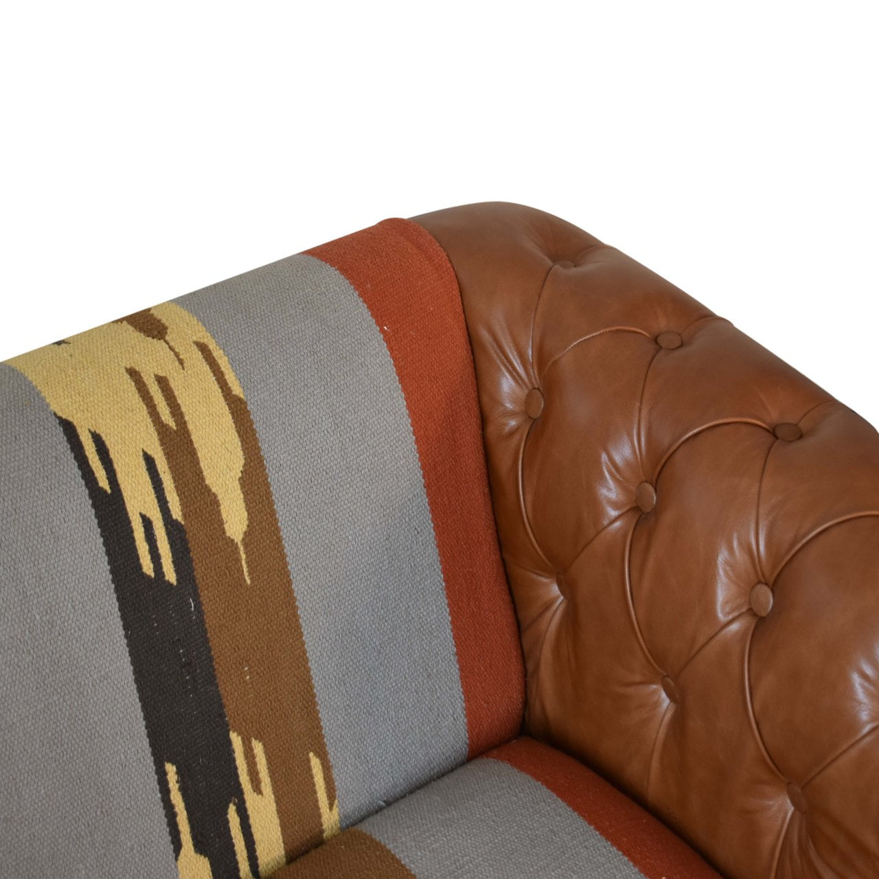 luxury leather and fabric mix sofa. Brown leather sofa with a patterned cushion