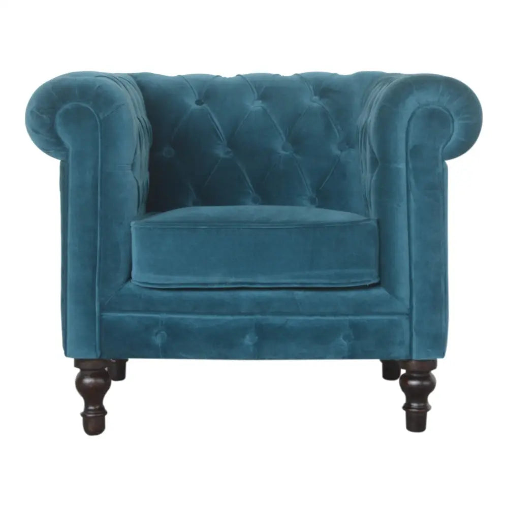 Eco-friendly home decor. Blue velvet Chesterfield armchair with tufted backrest