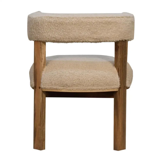 Boucle and wood occasional chair, with wooden legs and cream cushioned seat and backrest