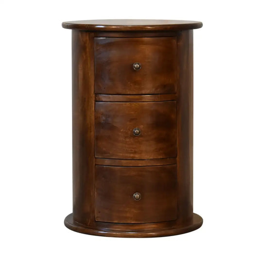 Eco-friendly home decor. Drum Bedside Table with Drawers Wooden cylindrical cabinet with three drawers. Sustainable furniture.