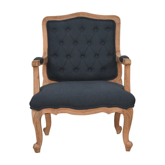 French style chair with arms. Chair with wooden frame and dark upholstered backrest