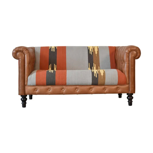 luxury leather and fabric mix sofa. Sofa with brown leather frame and patterned fabric backrest