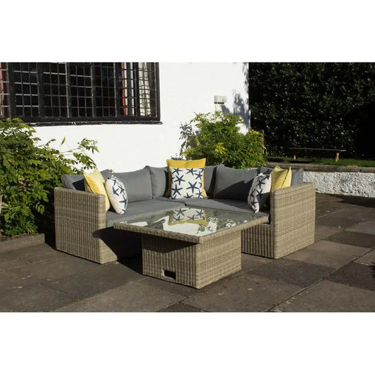Outdoor patio set with a sectional sofa and glass table for garden dining