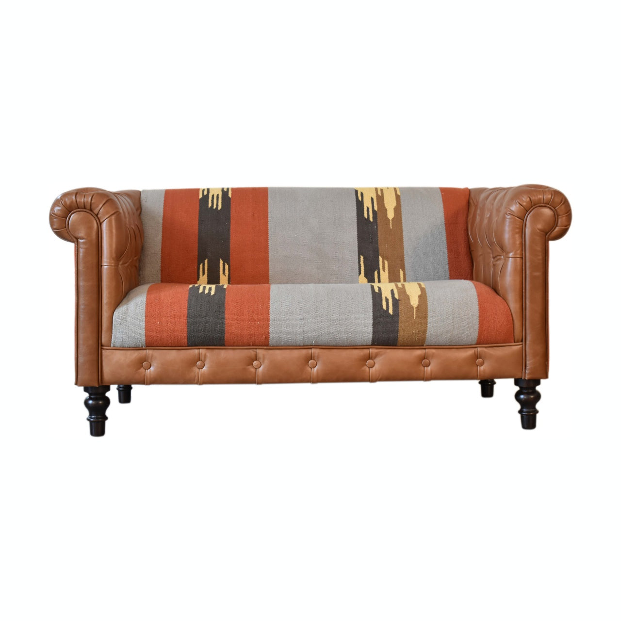 luxury leather and fabric mix sofa. Sofa with brown leather frame and patterned fabric backrest 