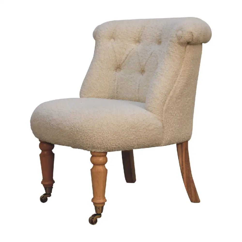 Cream boucle accent chair. Cream upholstered chair with wooden legs 