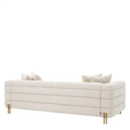York Bouclé Cream Sofa. With gold legs and art deco design. Cream sofa with gold legs shown from the back