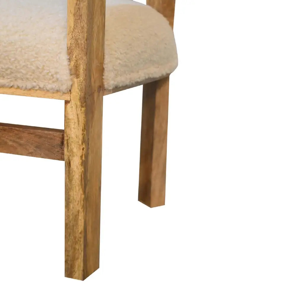 Boucle and wood occasional chair. wooden chair with cream cushioned seat and backrest