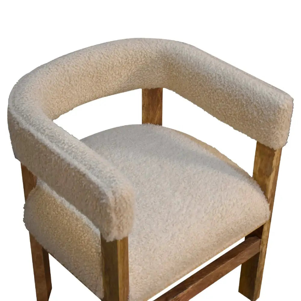 Boucle Chair with wooden frame and cream cushioned seat 