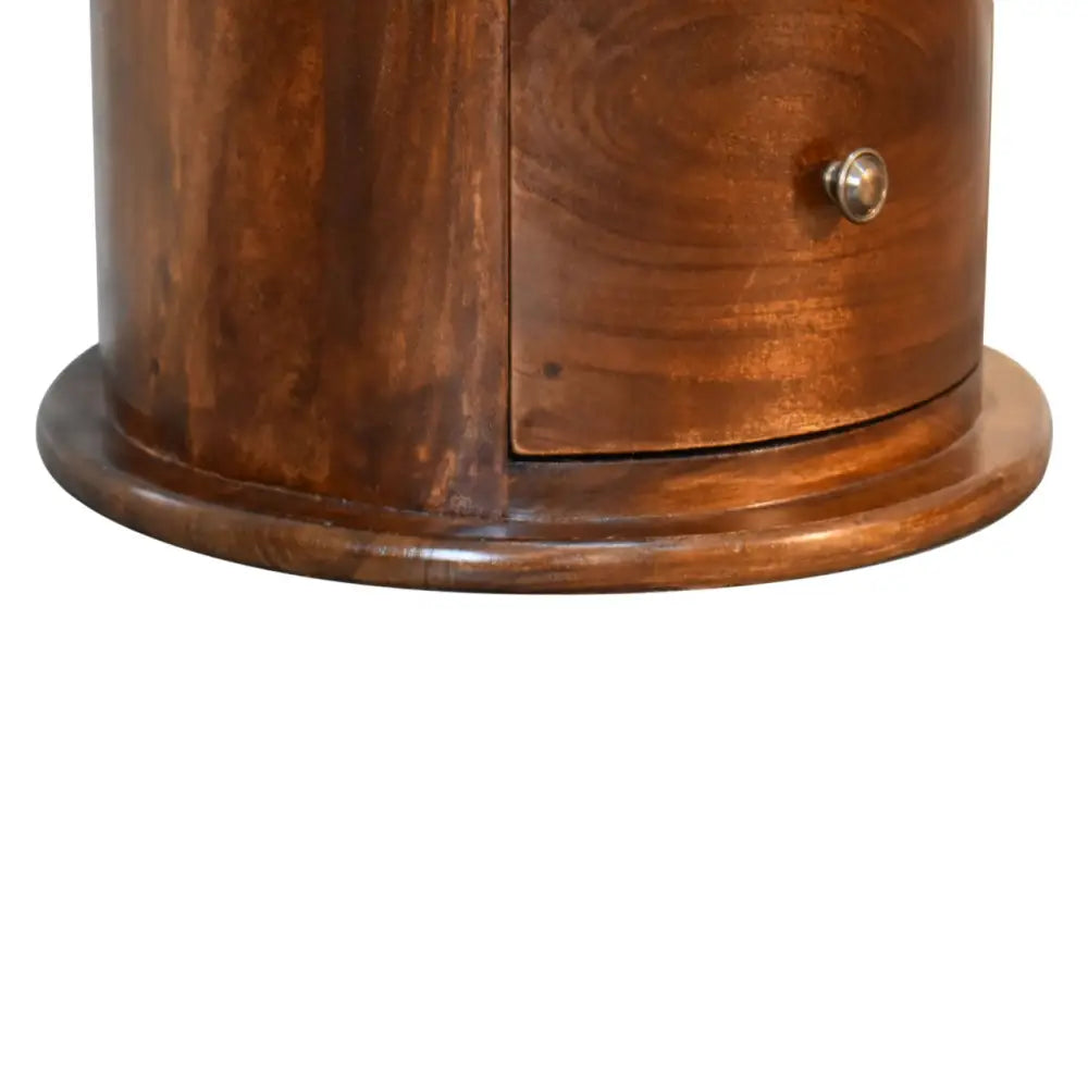 Drum Bedside Table with Drawers Close-up of a wooden cabinet with a metal knob. Sustainable furniture. Eco-friendly home decor.