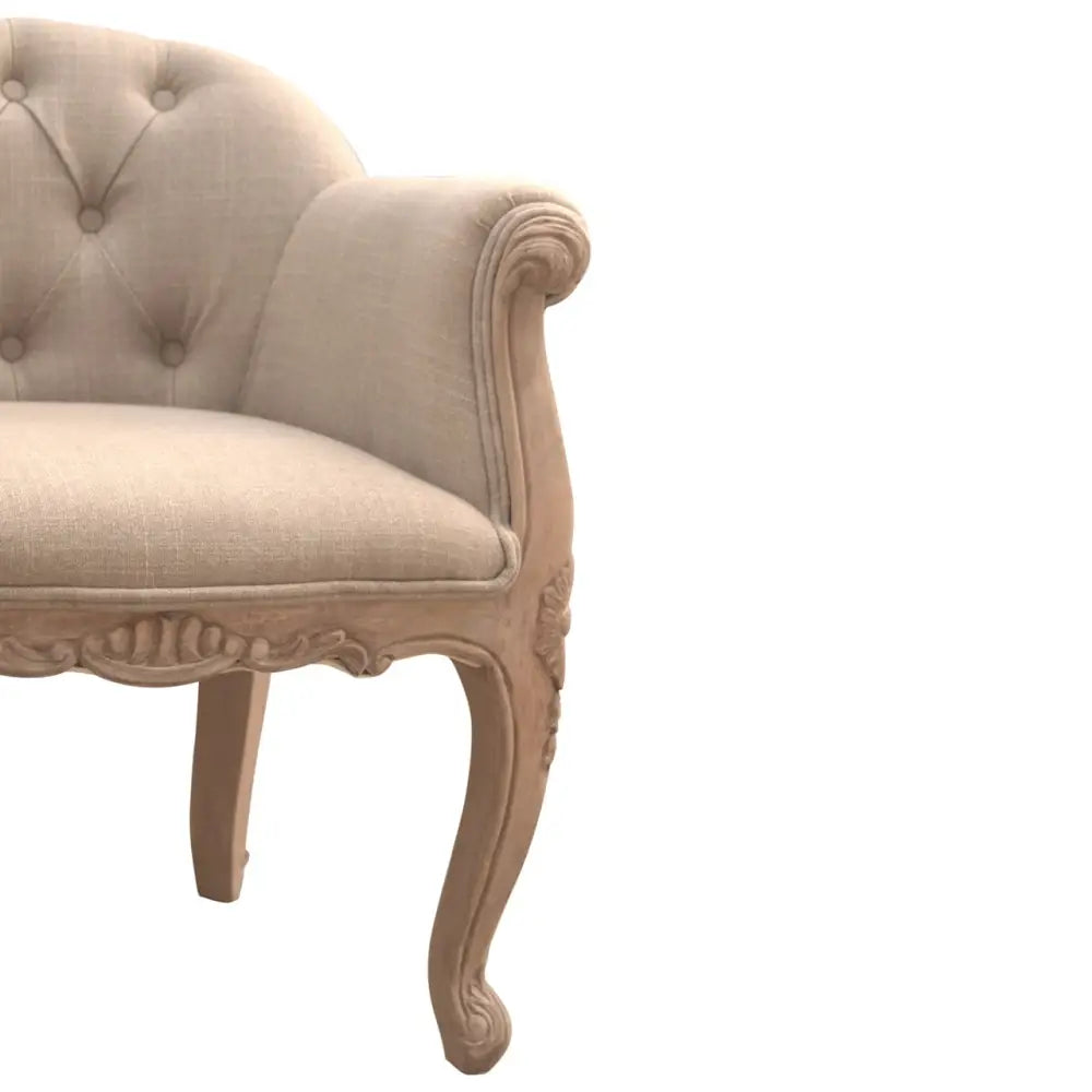 French Style Bedroom Chair. Beige armchair with decorative carvings