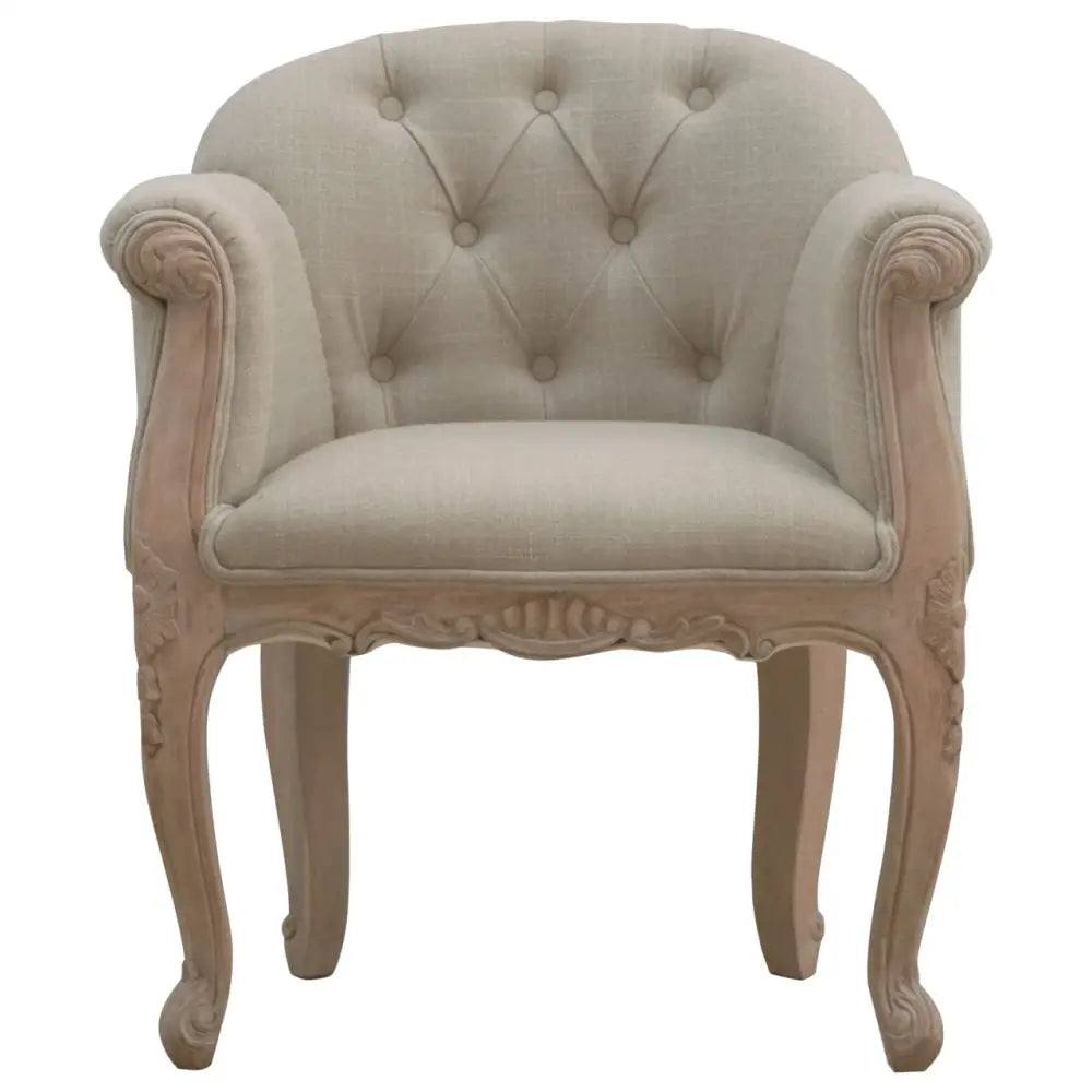 French Style Bedroom Chair. Beige armchair with tufted backrest 