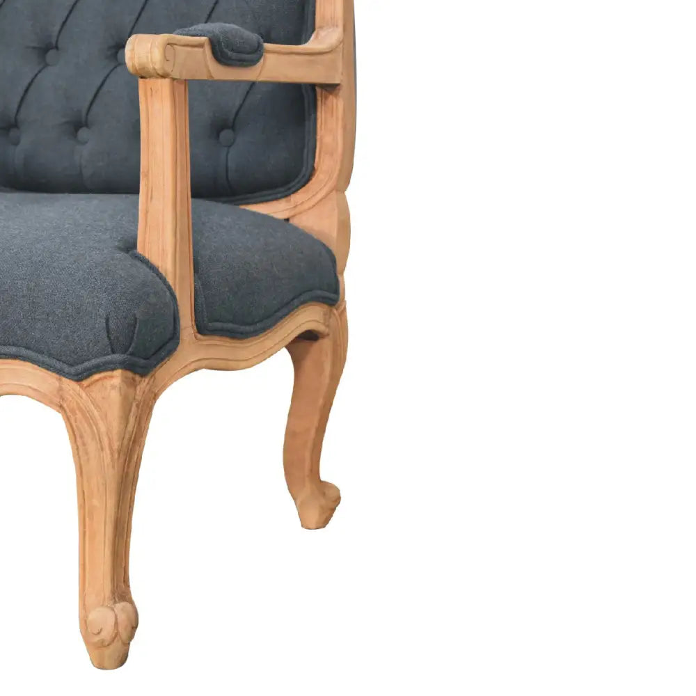 French style chair with arms. Chair with wooden frame and grey cushioned seat 