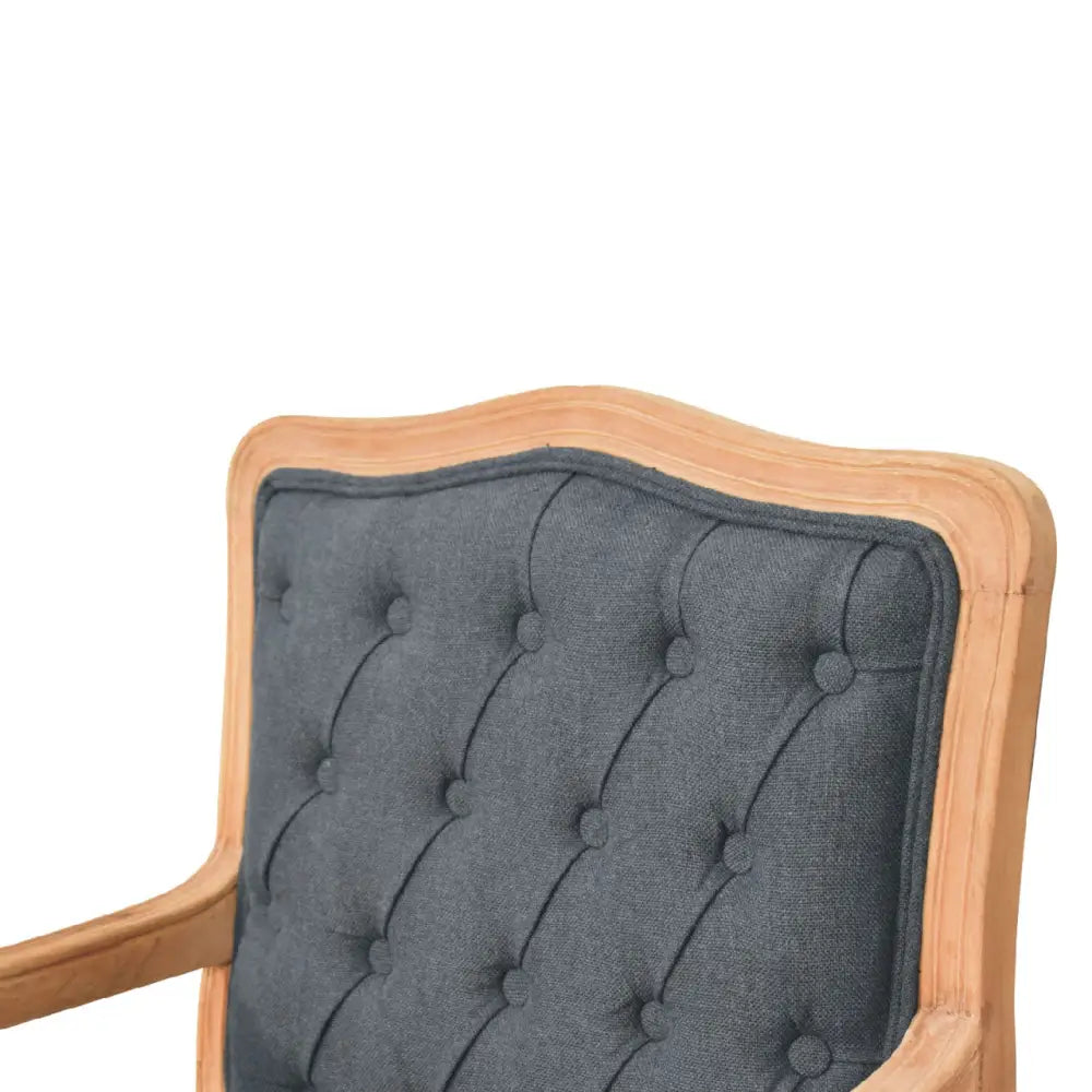 French style chair with arms. Chair with tufted grey backrest and wooden frame 