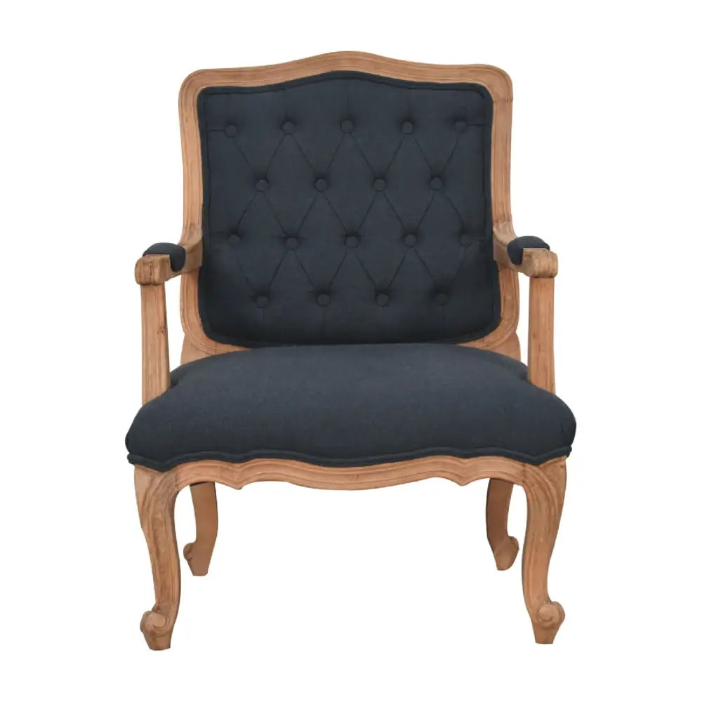 French style chair with arms. Chair with wooden frame and dark upholstered backrest