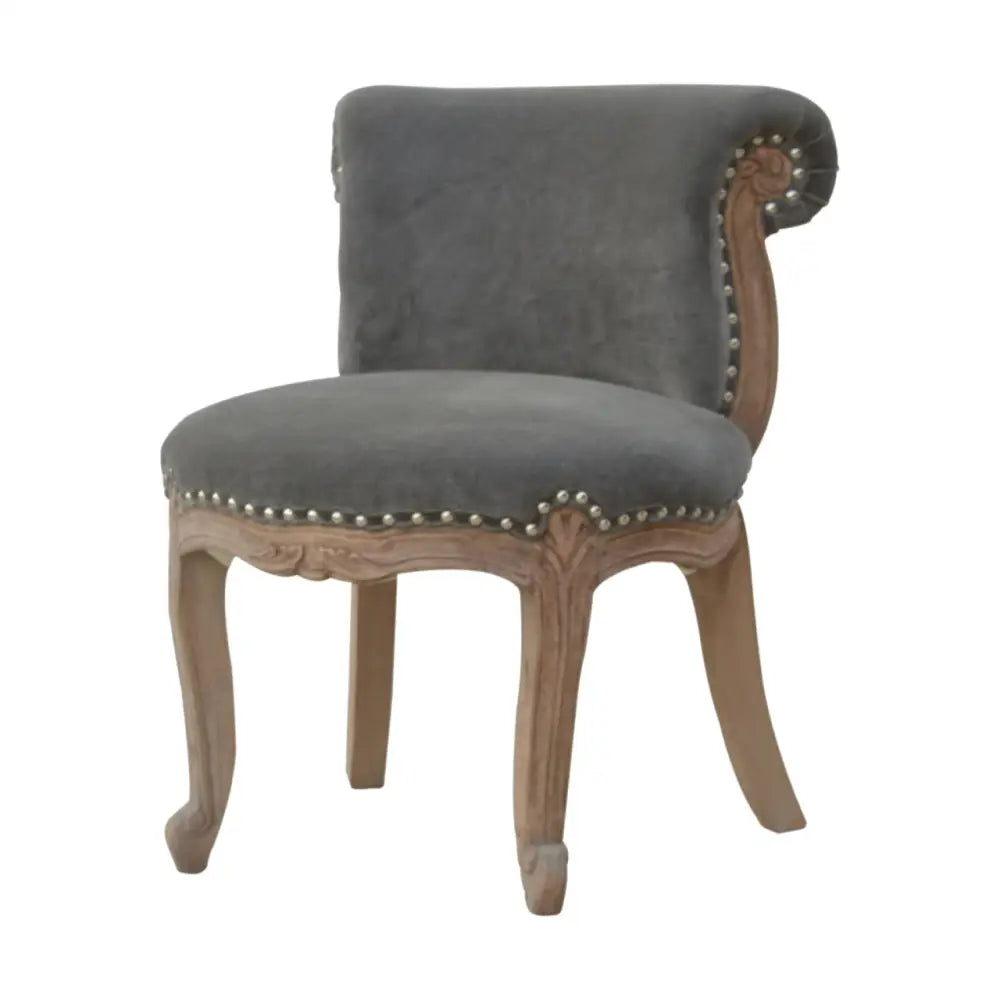 French Style Chair. Available in various sumptuous colours. Grey upholstered chair with wooden frame and nailhead trim 