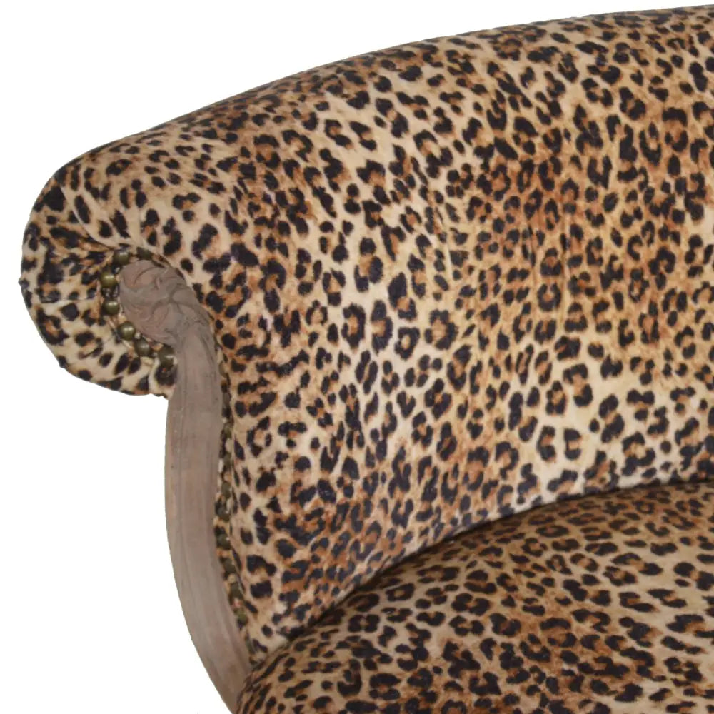 Leopard Print Velvet Chair. Close-up of a leopard print fabric 
