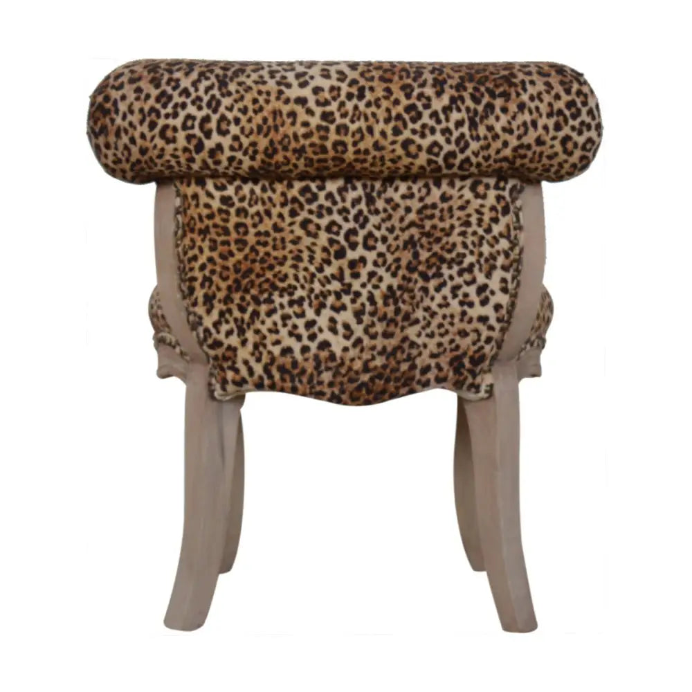 Leopard Print Velvet Chair with leopard print and light wooden legs 