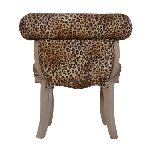 Leopard Print Velvet Chair with leopard print and light wooden legs 
