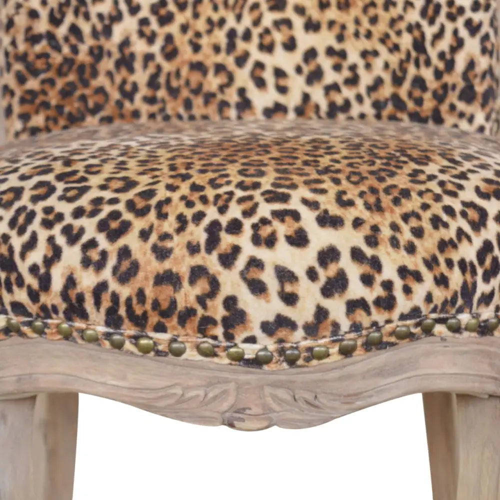 Leopard Print Velvet Chair. Chair with leopard print upholstery and wooden frame 
