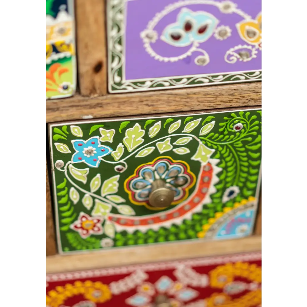 Hand-Painted 9-Drawer Sankalaka Cabinet. Decorative drawers with floral patterns and a handles