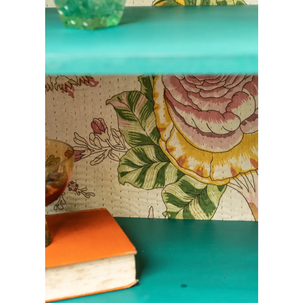 Hand-Painted Sea Green Glazed Cabinet. Floral-patterned wallpaper with a turquoise shelf 