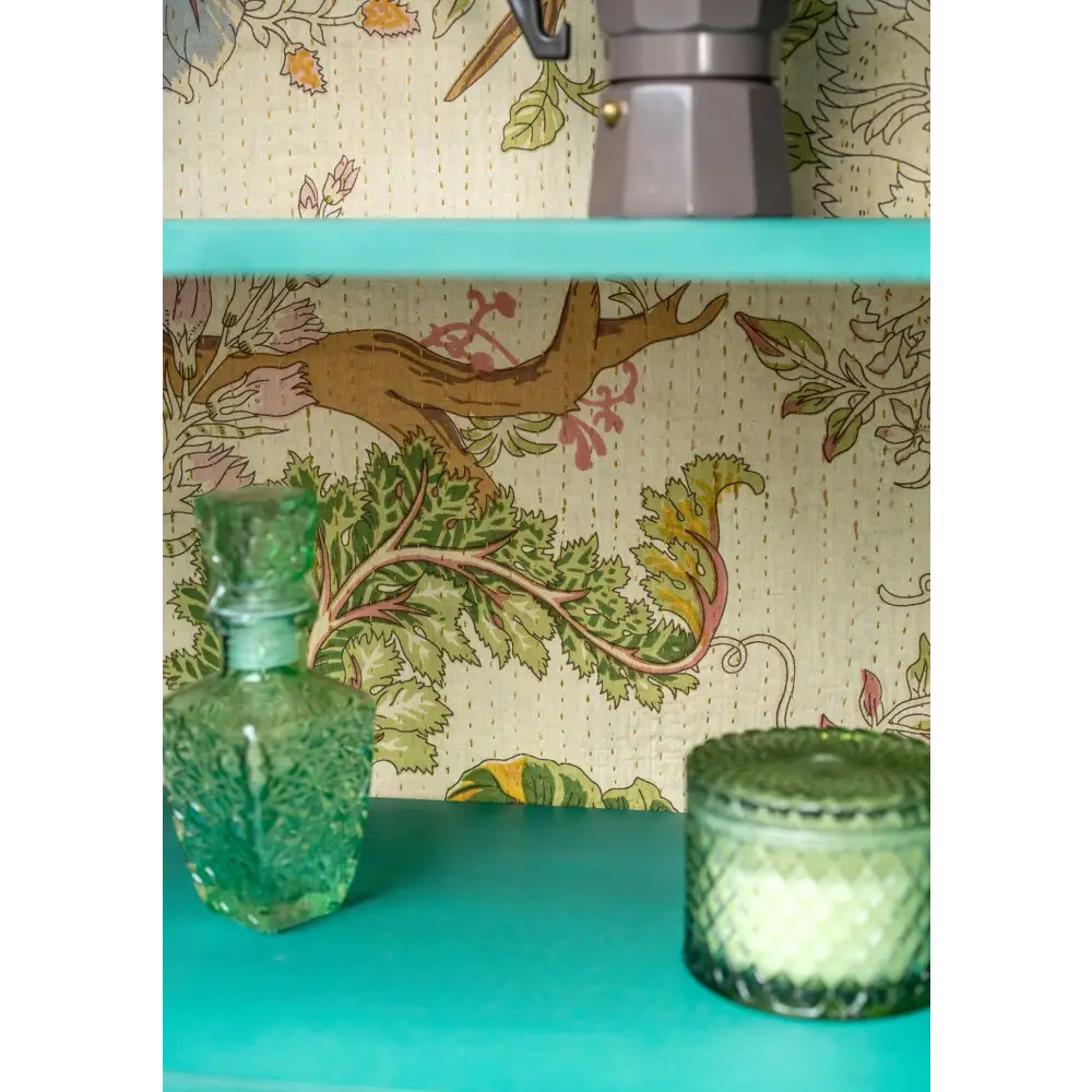 Hand-Painted Sea Green Glazed Cabinet.  floral wallpaper in the background