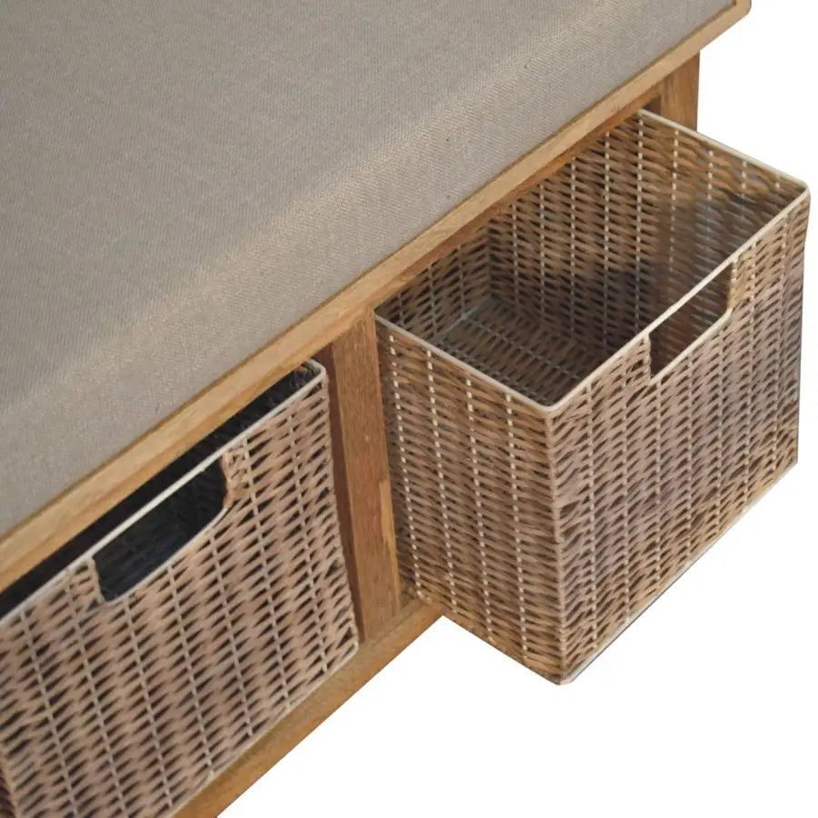 Ethical wood sourcing. Indoor bench seating with storage and cushion Wooden bench with woven storage baskets. Eco-friendly home decor.