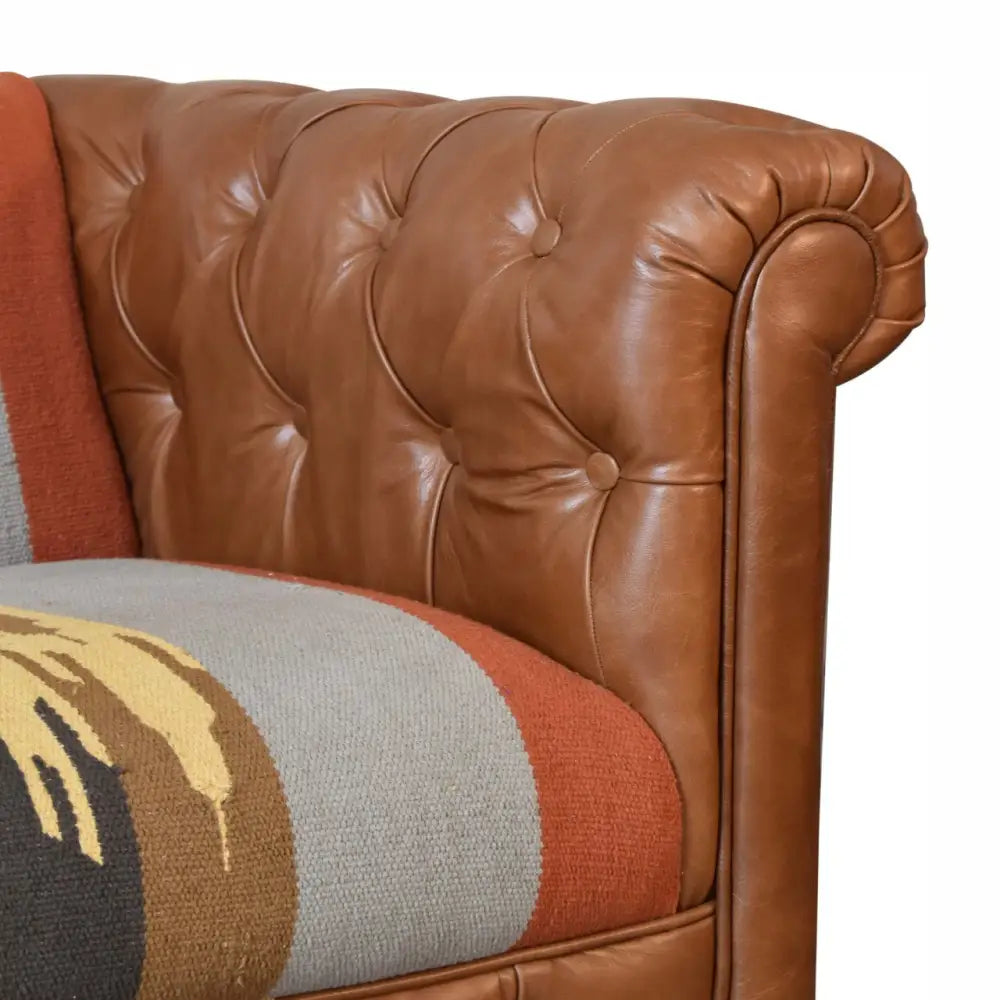 luxury leather and fabric mix sofa. Brown leather sofa with a patterned cushion seat 