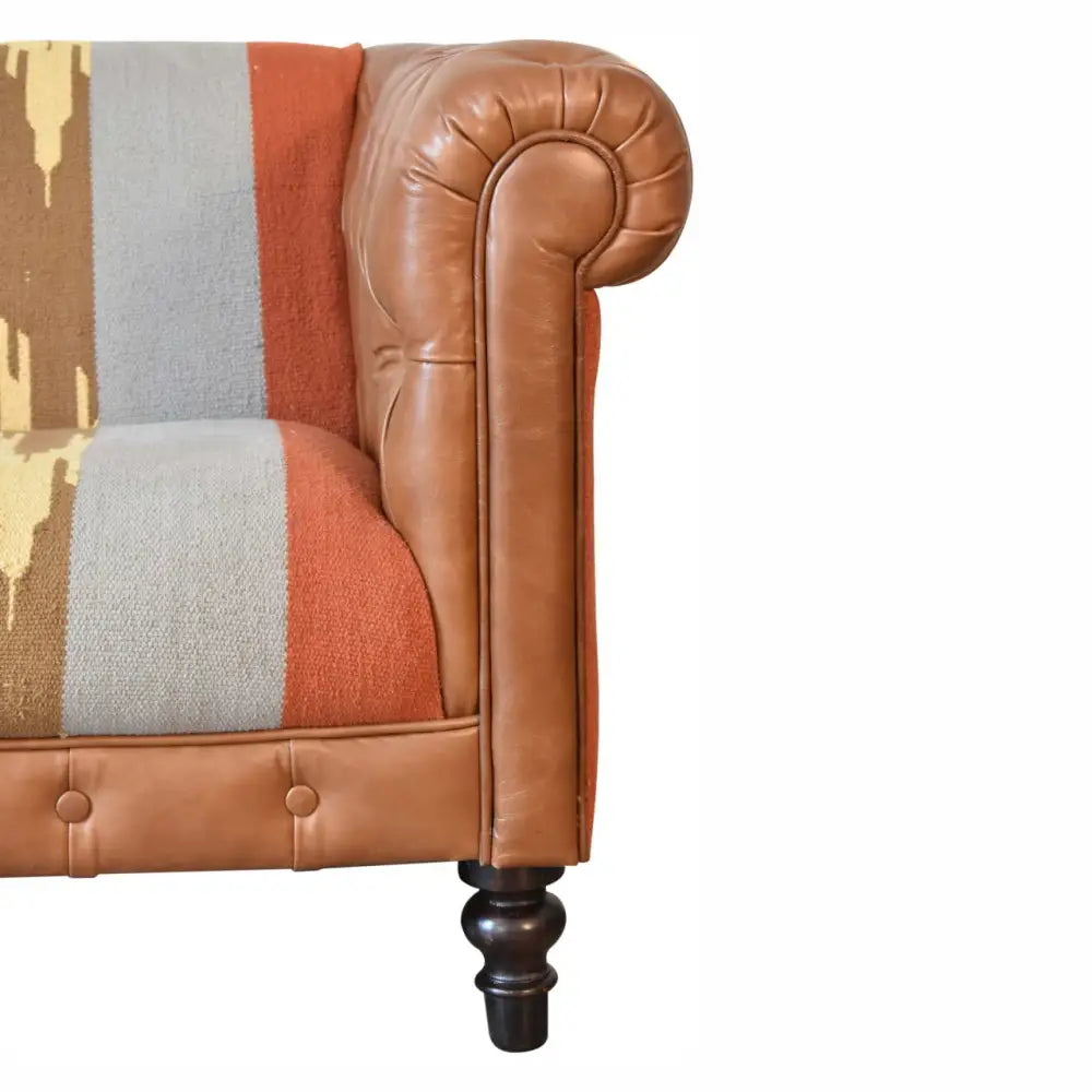 luxury leather and fabric mix sofa. Corner of a brown leather sofa with a patchwork cushion seat 