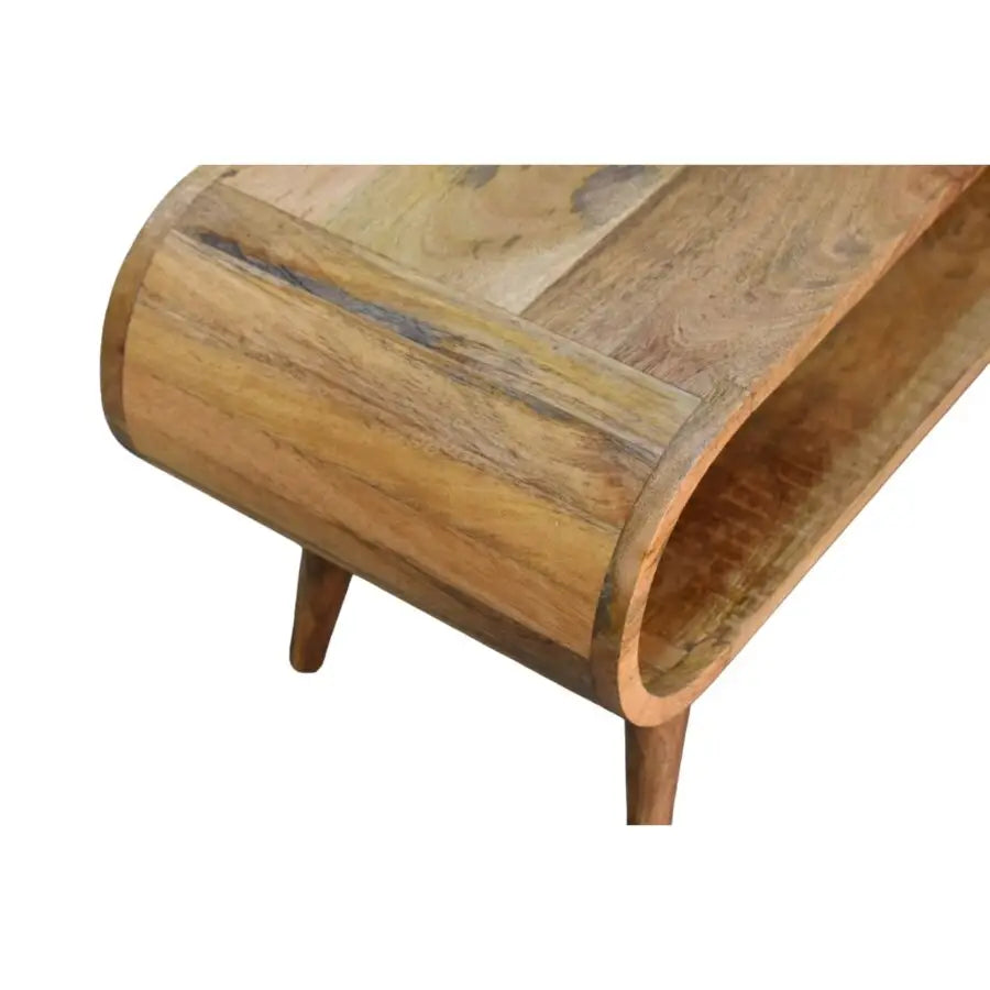 Wooden oval  coffee table with a curved design. Mango Wood Coffee Table. Eco-friendly home decor. Ethical wood sourcing.