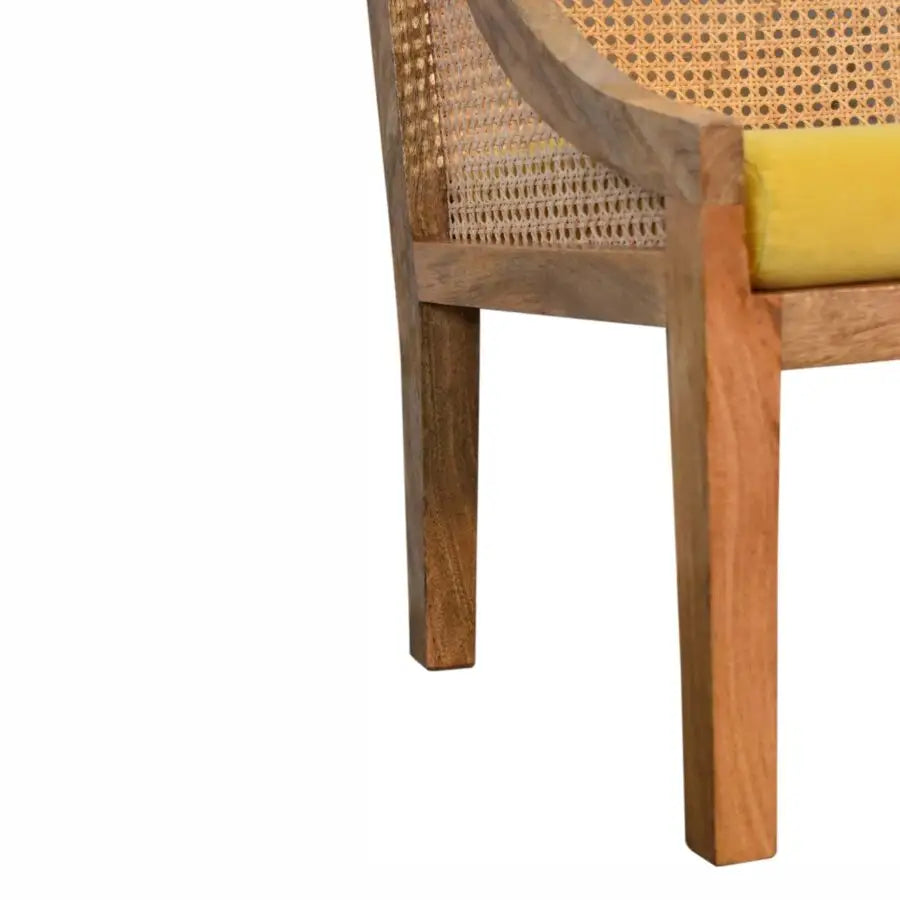 Rattan chair with wicker backrest and yellow cushion and in various other sumptuous colours
