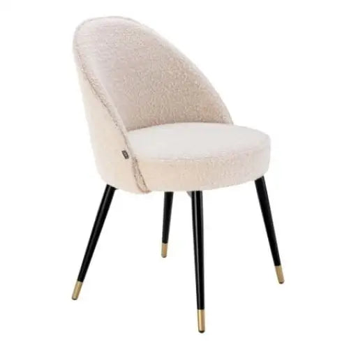 Luxury Cream upholstered dining chair with black legs and gold foot caps 