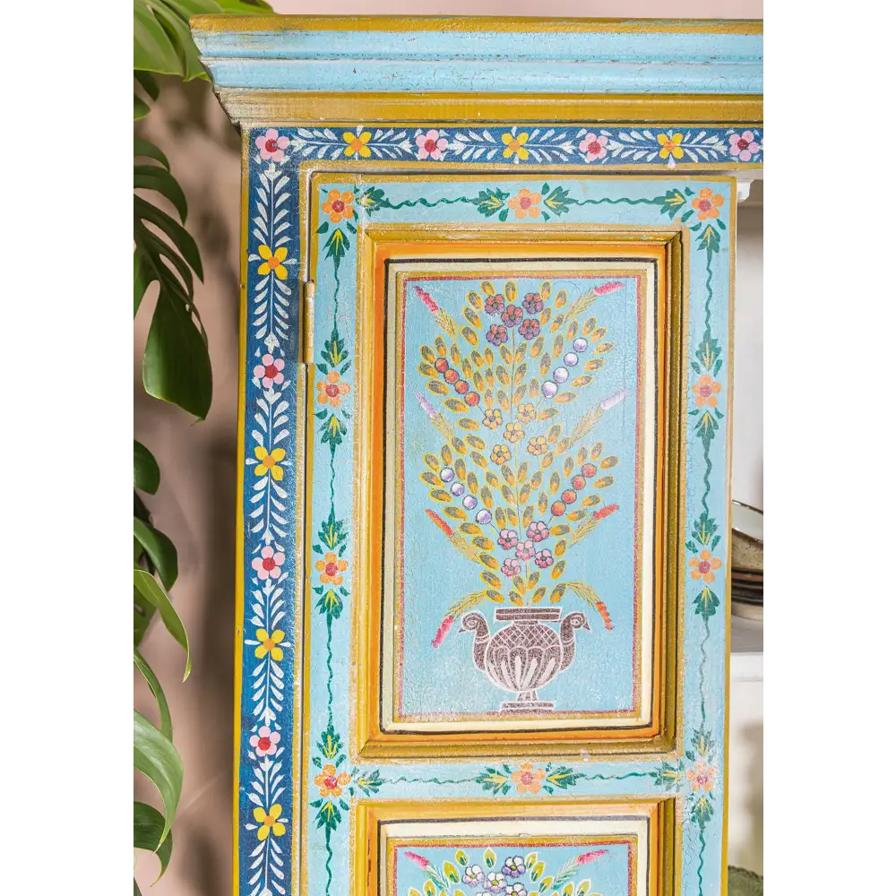 Tall Hand Painted Cupboard. Decorative panels with floral patterns and a central vase design.
