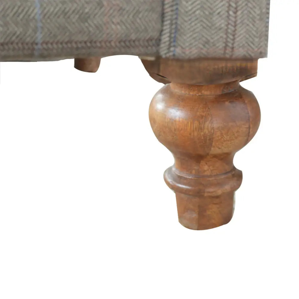 Tweed Chesterfield Sofa. Close-up of a wooden leg 
