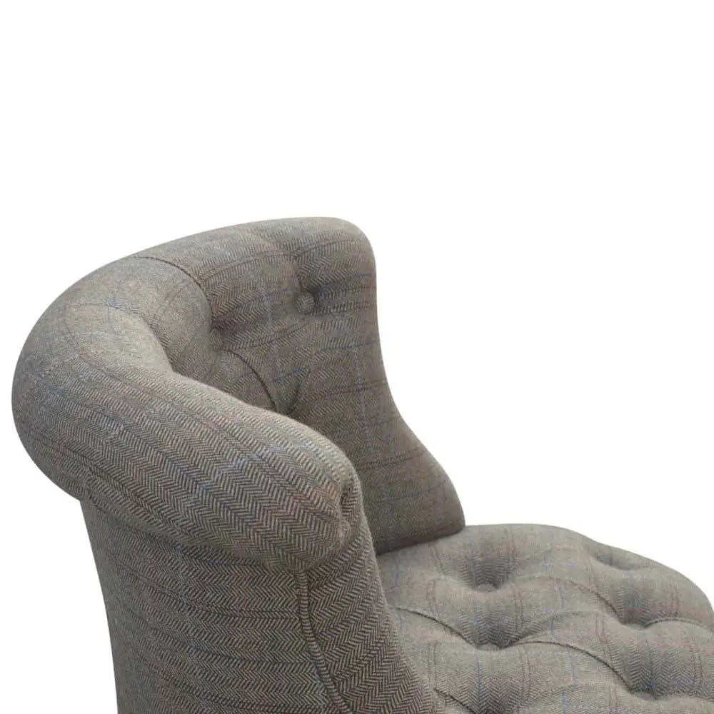 Tweed occasional chair. Grey upholstered chair with tufted backrest 