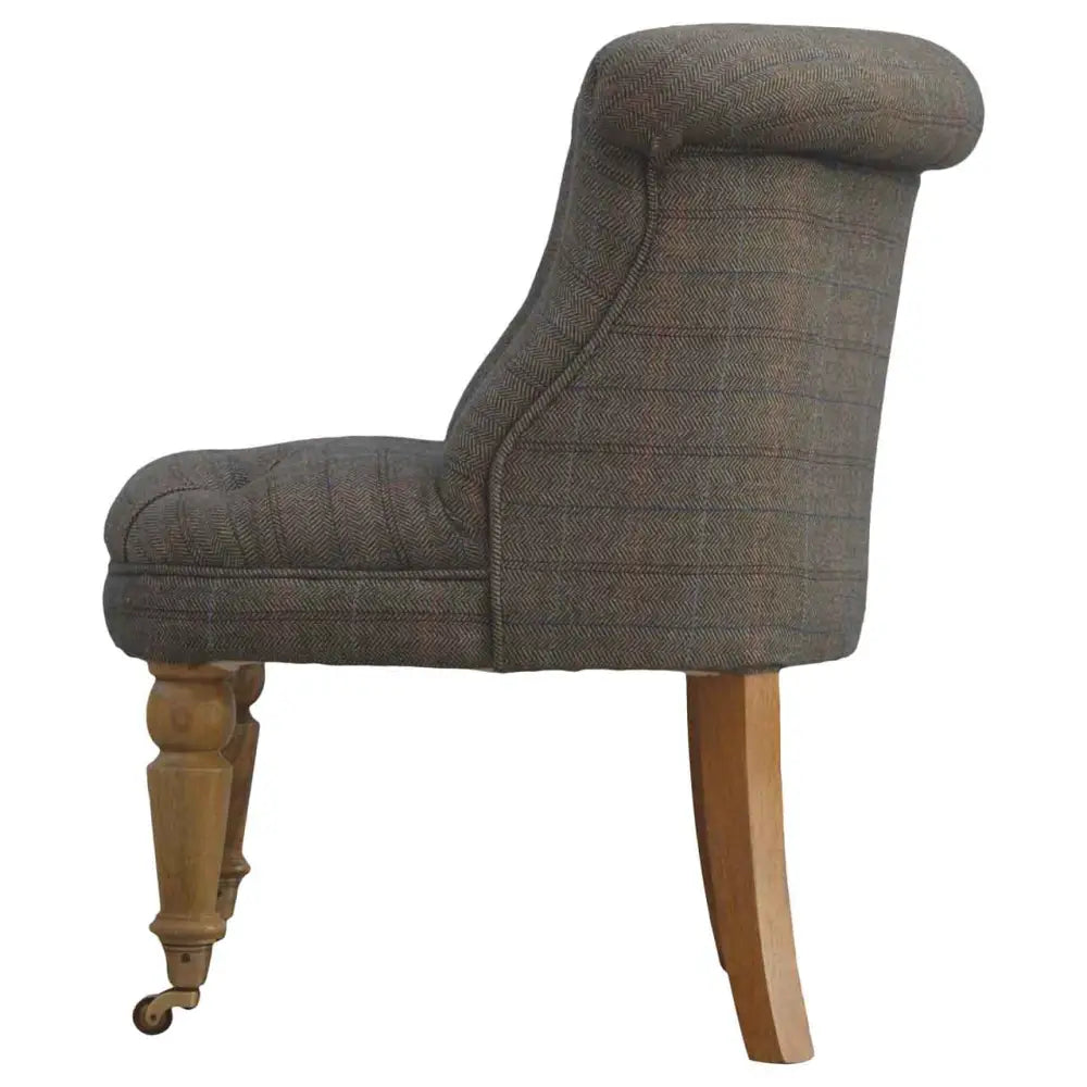 Tweed occasional chair. Chair with plaid fabric and wooden legs 