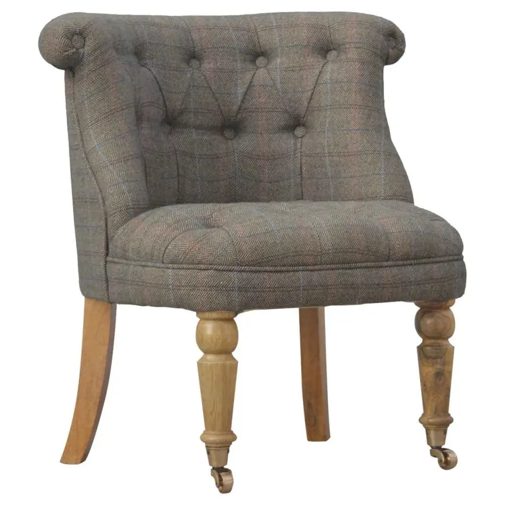 Tweed occasional chair. Chair with plaid fabric and wooden legs 